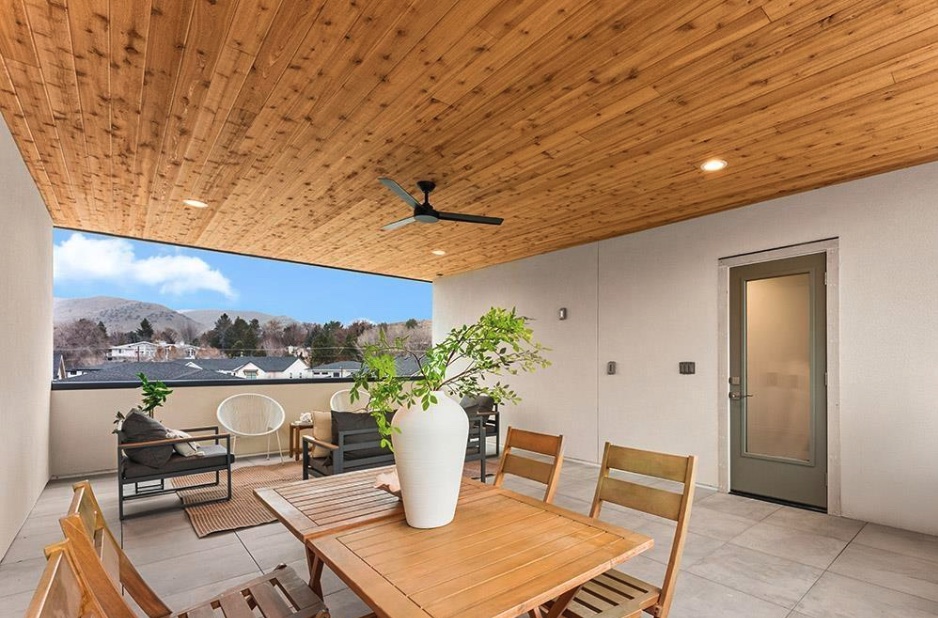 Covered patio with a finished wood plank ceiling and tiled floor