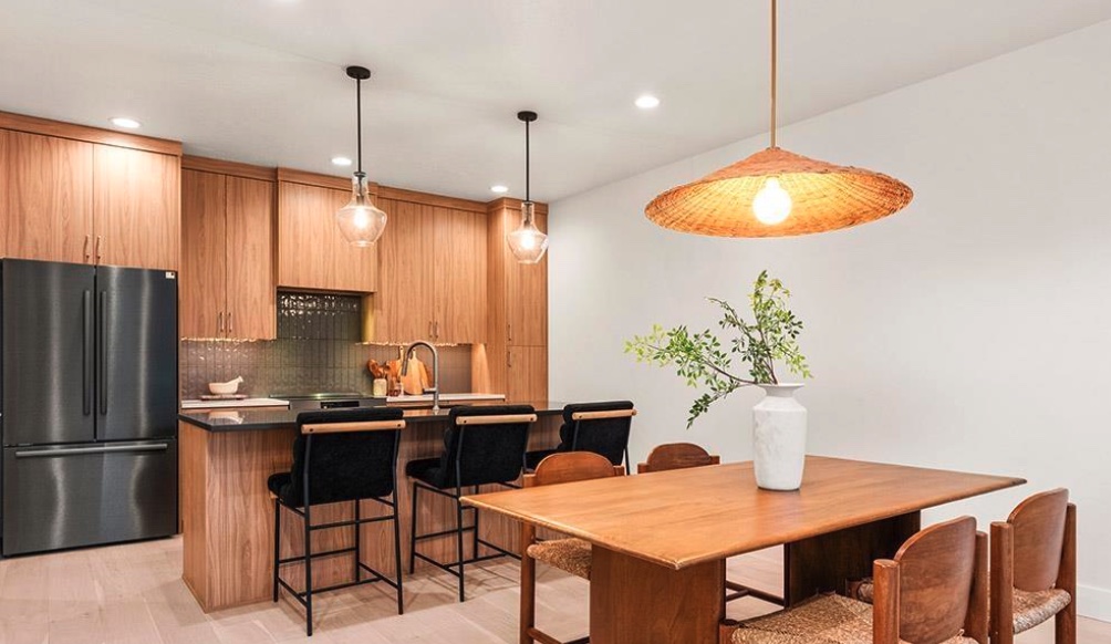 Kitchen and dining area with finished light wood flooring