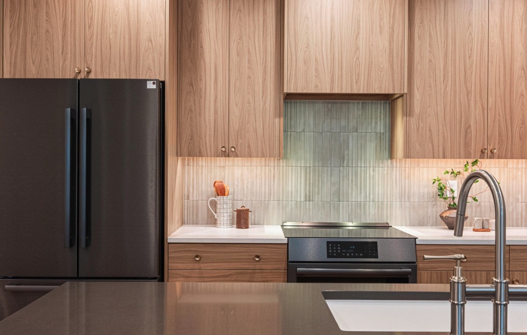 Kitchen detail showing the vertical tile backsplash